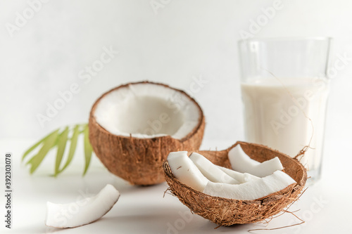 Wallpaper Mural coconut and coconut milk in a glass Cup on a light background. copy space. selective focus, close up Torontodigital.ca