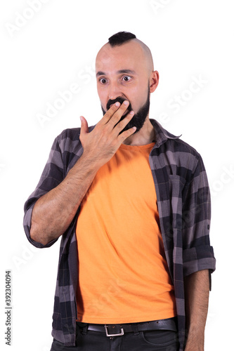 Gossiping young man making a mixed gesture of surprise and shame