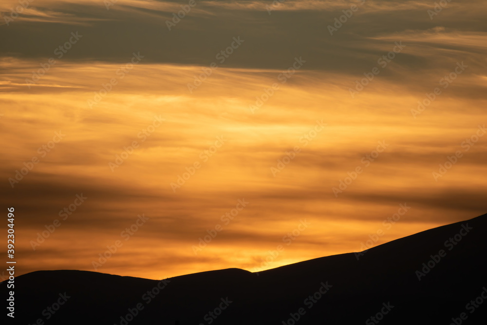 Sunrise, sunset over mountains silhouette background. Wallpaper, card.