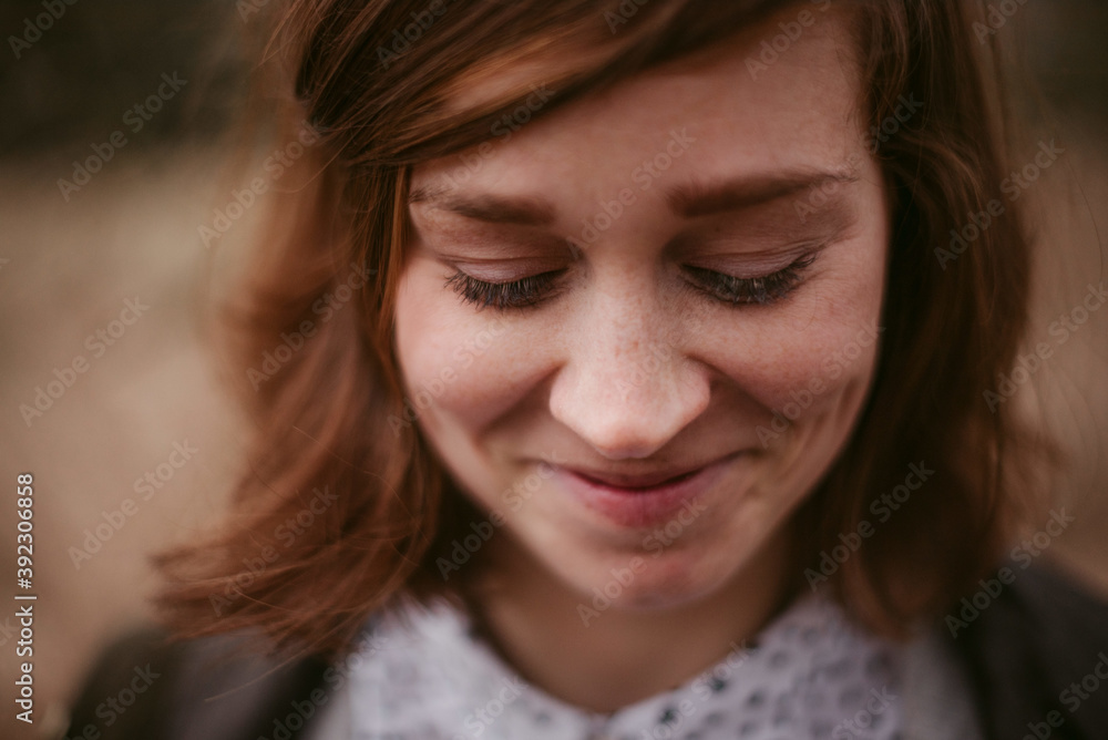 Happy timid young woman with lovely smile Happy timid young woman with lovely smile