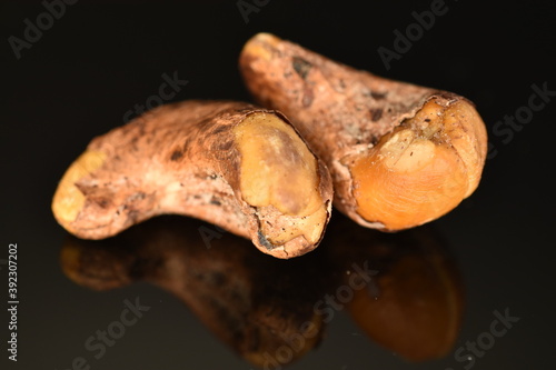 Fragrant fried salted cashews, close-up, isolated on black.