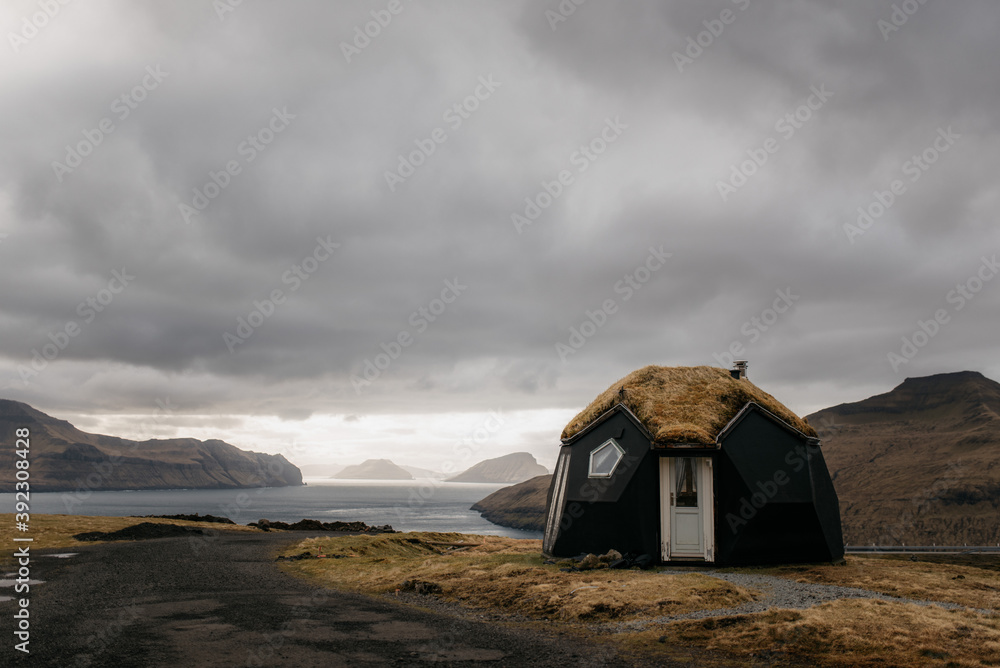 Lonely cabin on seashore in Nordic countryside Lonely cabin on seashore in Nordic countryside