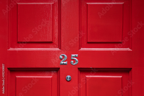 Detail of a red door with number