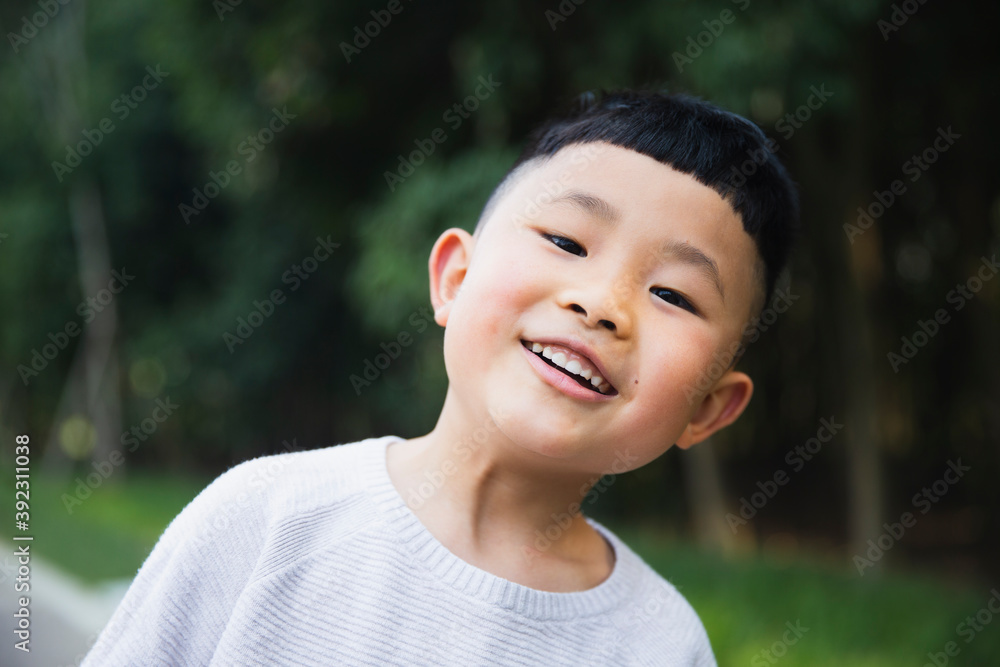 little asian boy portrait in the park little asian boy portrait in the park