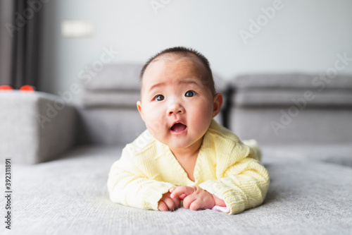 portrait of little asian baby at home photo