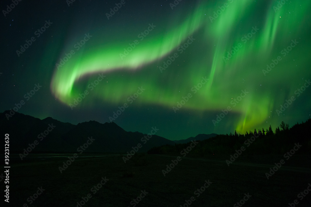 Aurora over mountains in Alaska