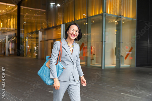 Pretty Asian businesswoman in the city portrait photo