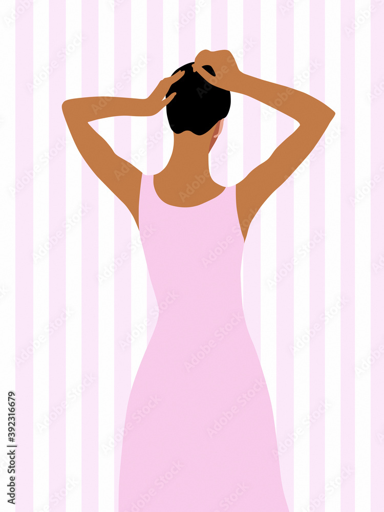 Young woman making hair bun Young woman making hair bun