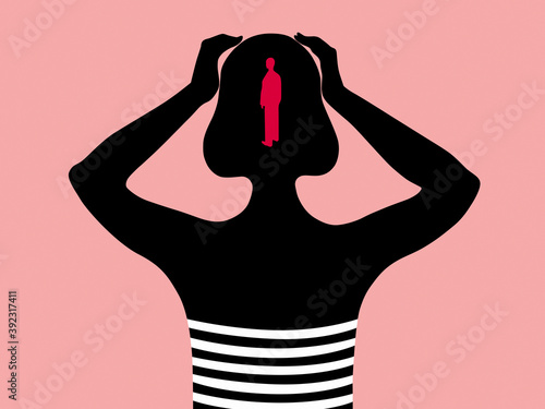 Silhouette of a woman holding her head with a figure of a man inside photo