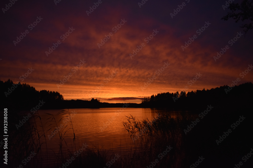 bright orange sunset on the lake