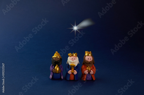 Fototapeta Happy Epiiphany day. Three wise man ant star on blue background.