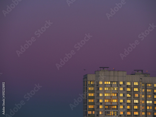 Apartment building with sunset reflection photo