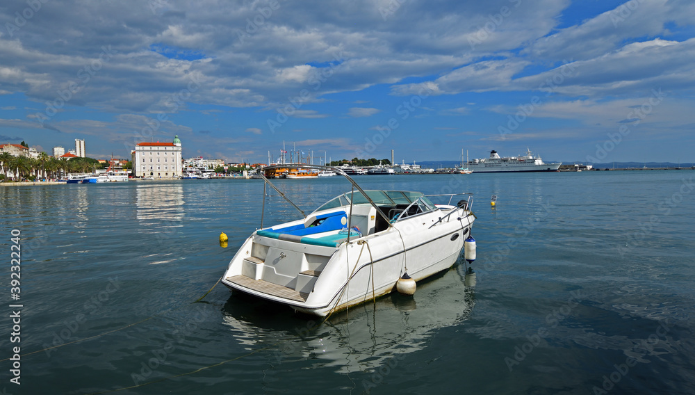 Fototapeta premium Power Boat moored at the harbour of Split Croatia with blue sky and clouds.