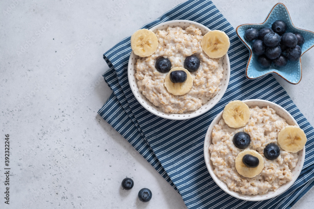 Kids breakfast oatmeal porridge with funny bear face