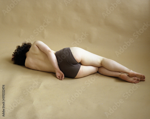 Girl in panties laying on the floor