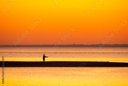 Fishing on the Beach at Sunset