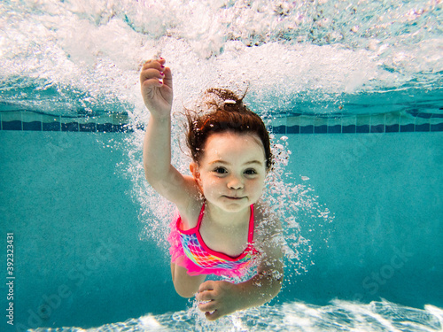 Little girl underwater.