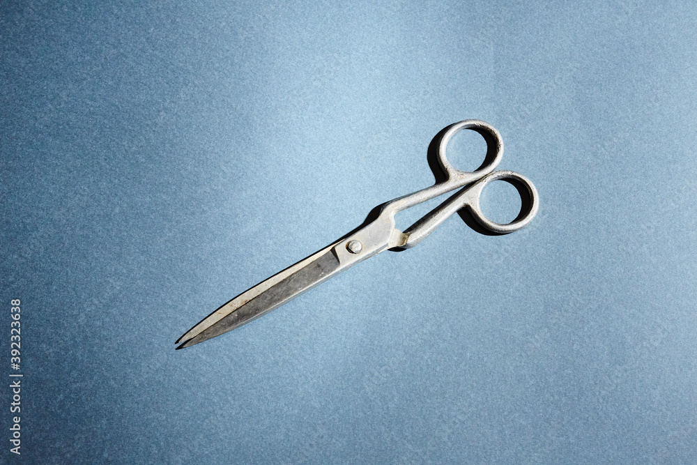 scissors on a blue background scissors on a blue background