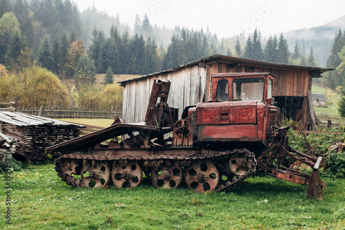 old tracked skidder in the village
