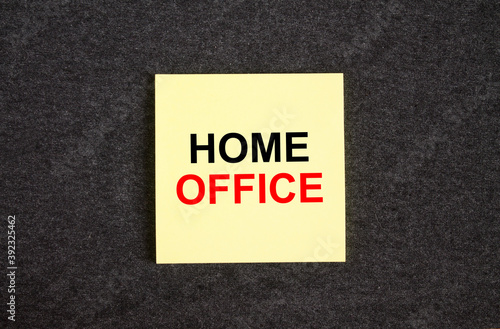 Yellow sticker on the dark gray texture background with text Home Office
