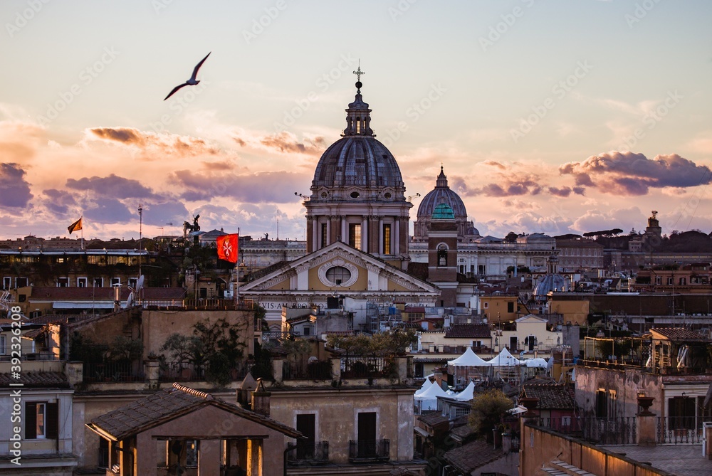 Rome skyline at sunset with St. Peter's Basilica in center