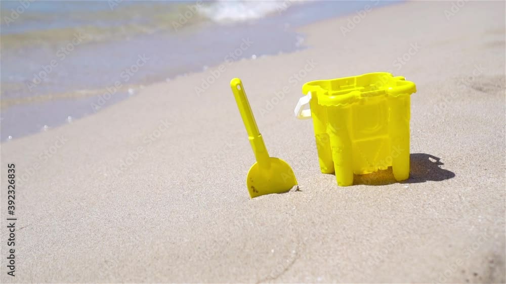 Beach kid's toys on white sand beach Beach kid's toys on white sand beach