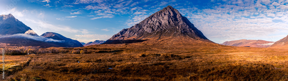 Buachaille Etive Mor, highly detailed, bright blue sky with cloud formations on an autumn day