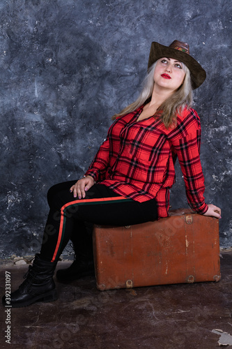 Attractive plump woman dressed in cow boy style photo