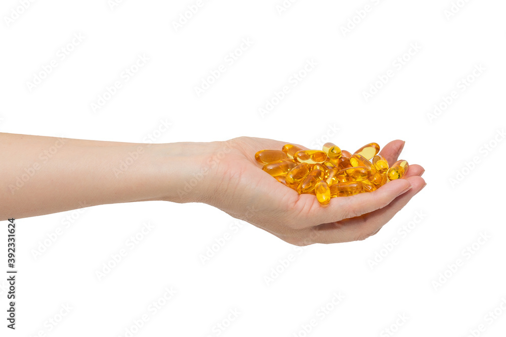 Female hand with a bunch of omega-3 capsules Female hand with a bunch of omega-3 capsules