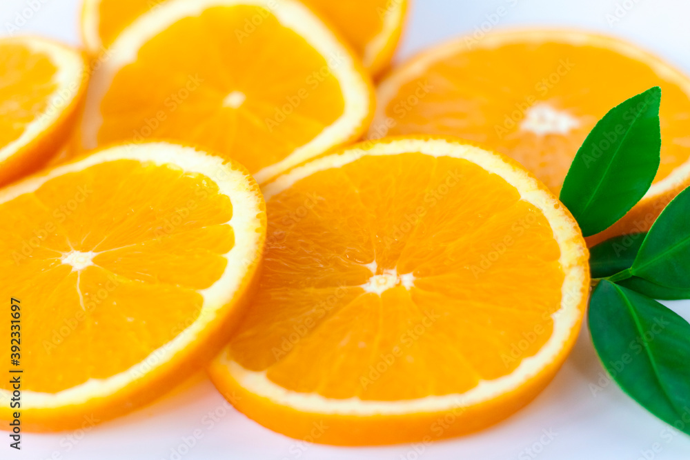 Cut orange on a white background. Natural orange fruit with cut slices. Vitamin C. Cut orange on a white background. Natural orange fruit with cut slices. Vitamin C.
