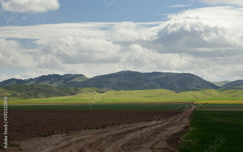 San Joaquin valley farmland with heavy clouds