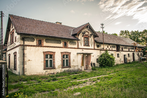 Closeup of a house in a field with a field of green grass photo