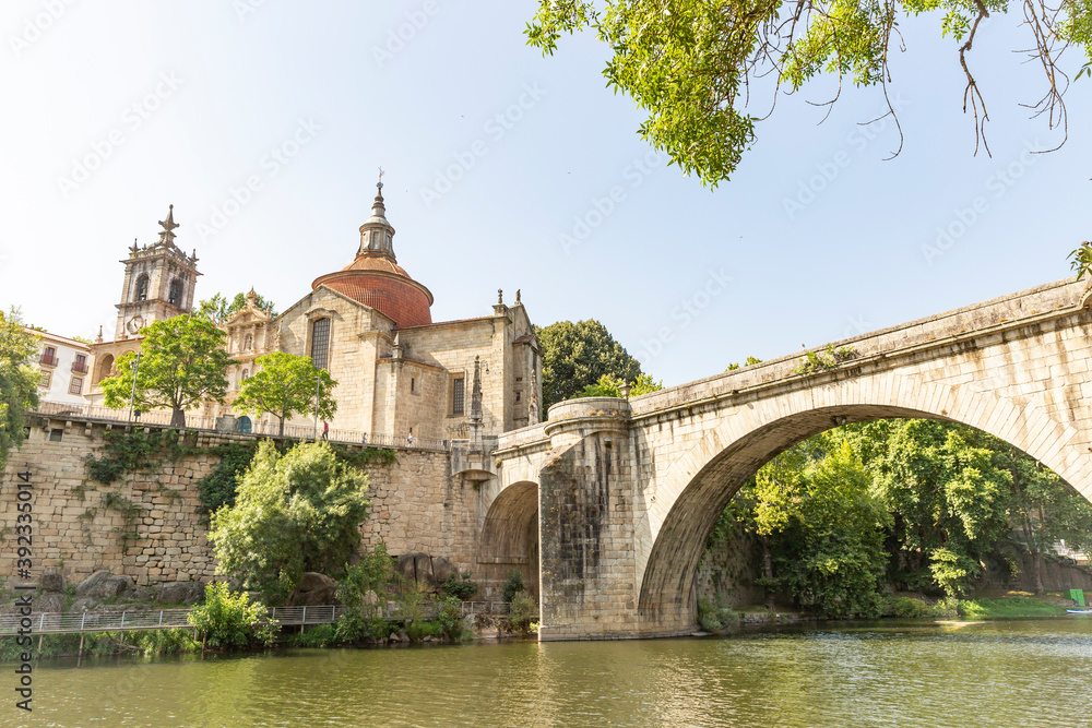 the old bridge over Tamega river and the monastery of Sao Goncalo in Amarante city, Porto District, Douro Litoral, Portugal