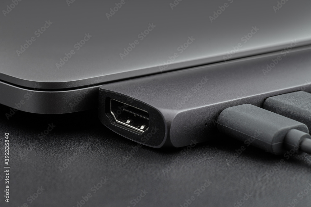 Close-up photo oh HDMI port of type-c hub with cables connected to laptop  Stock Photo | Adobe Stock