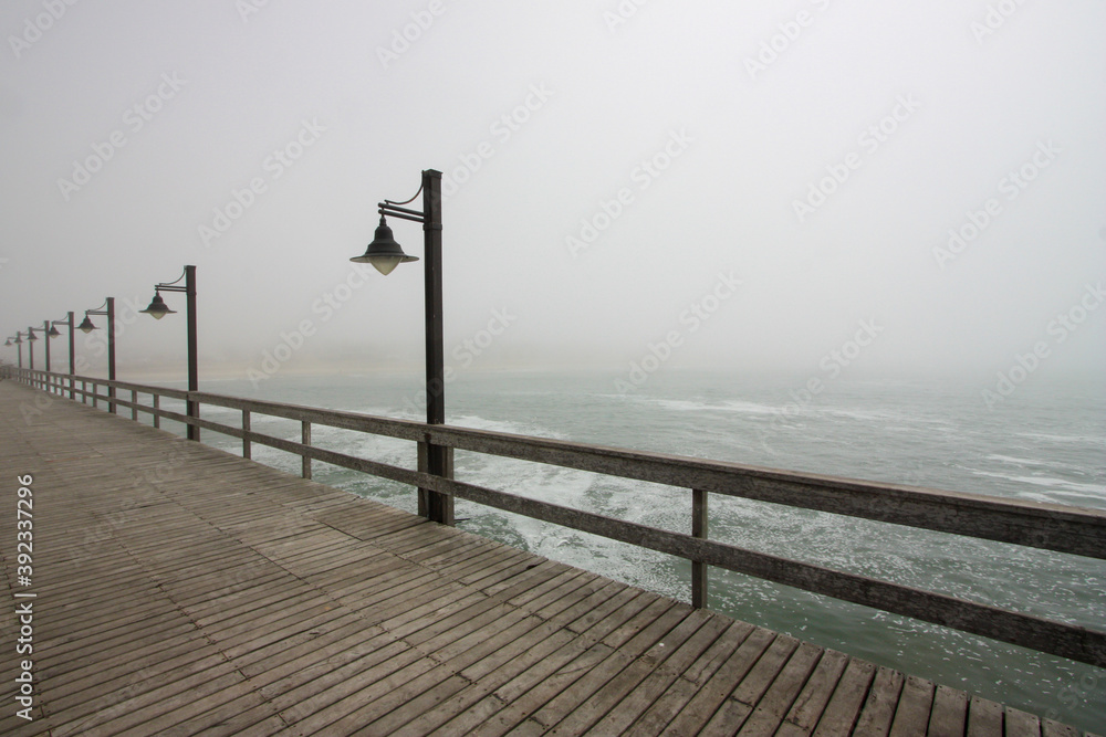 Wooden pier on a foggy day