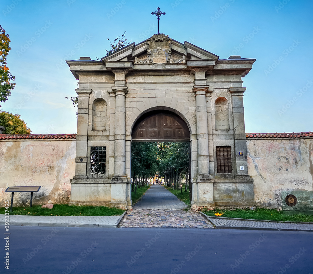 Entrance gates of Pazaislis Monastery and alley of lindens