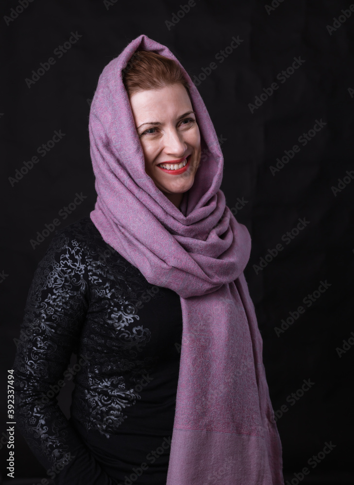 Beautiful lady in neckerchief studio portrait on black background. Beautiful lady in neckerchief studio portrait on black background.