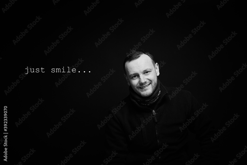 Portrait of a smiling person on a black background Portrait of a smiling person on a black background