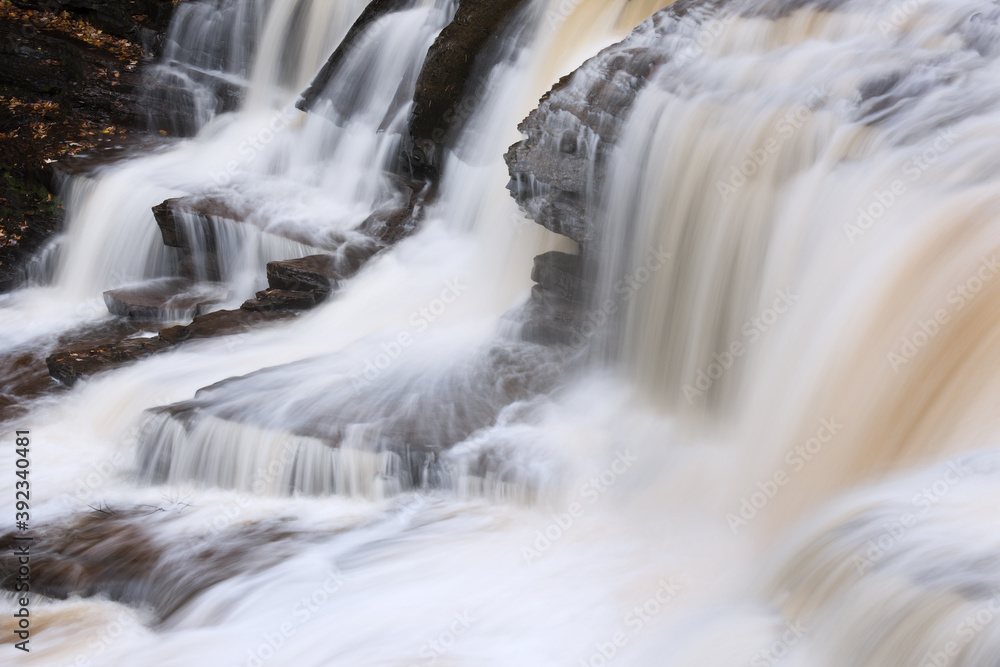Landscape of Manido Falls captured with motion blur, Porcupine Mountains Wilderness State Park, Michigan's Upper Peninsula, USA Landscape of Manido Falls captured with motion blur, Porcupine Mountains Wilderness State Park, Michigan's Upper Peninsula, USA