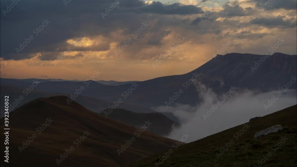 Amazing sunset with thick flowing clouds in the Caucasus mountains. Kabardino-Balkaria. Timelapse. Amazing sunset with thick flowing clouds in the Caucasus mountains. Kabardino-Balkaria. Timelapse.