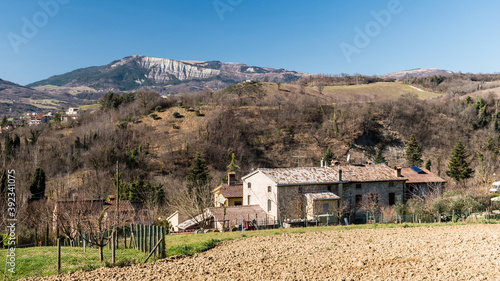 Panoramic view of hills in the Montefeltro area (Marche, Italy) with mount Carpegna in the background photo