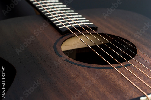 Wooden classical acoustic guitar. Close up.