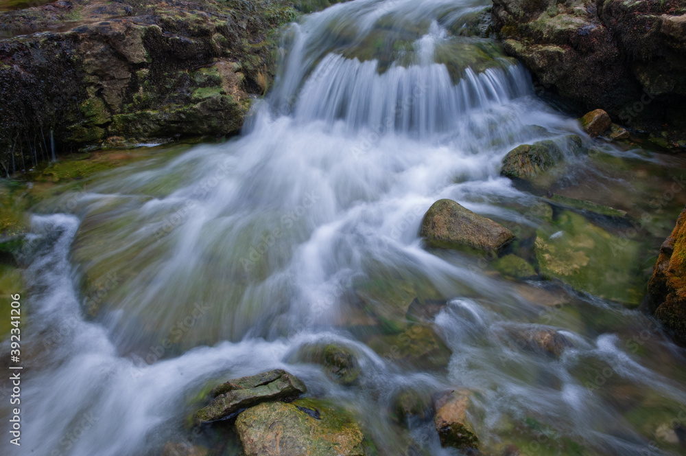 Landscape of a cascade at Autrain Falls captured with motion blur, Hiawatha National Forest, Michigan's Upper Peninsula, USA Landscape of a cascade at Autrain Falls captured with motion blur, Hiawatha National Forest, Michigan's Upper Peninsula, USA