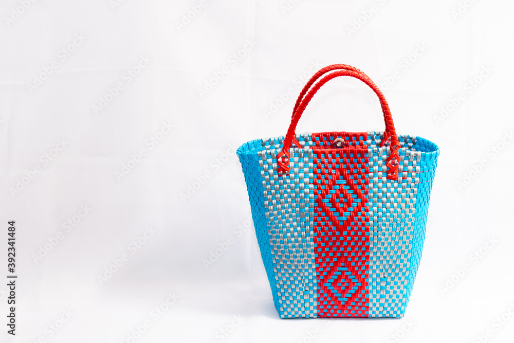 Plastic weave basket handmade on white background in Guatemala Plastic weave basket handmade on white background in Guatemala