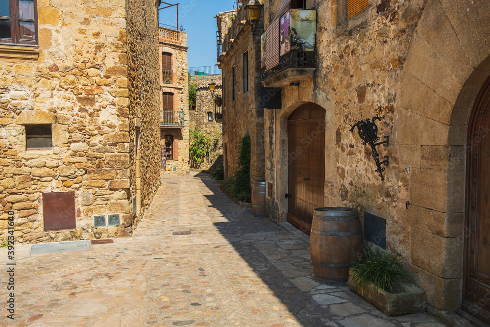 Obraz premium Cozy narrow little streets in a Catalan fishing village on the Costa Brava, Mediterranean Sea