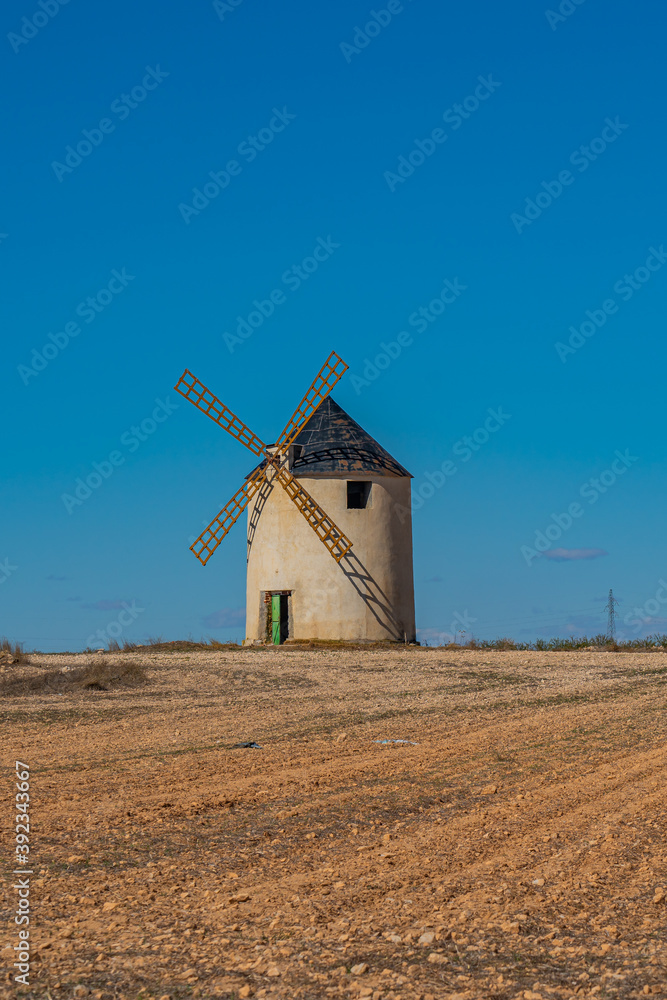 Windmill at the Don Quixote route in Spain, vertical Windmill at the Don Quixote route in Spain, vertical