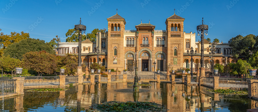 Fototapeta premium The Plaza de America and the Museum of Popular Arts in Seville, Spain. It is located in the Parque de Maria Luisa. panorama