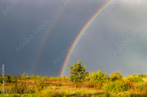 Double rainbow over the stormy sky