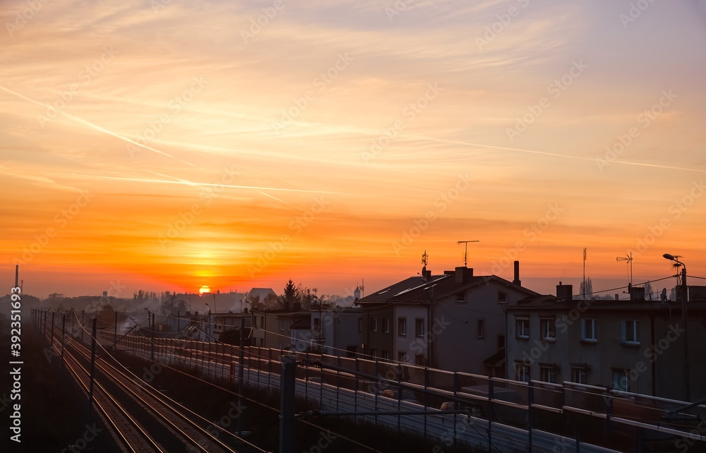 Smoke from several houses, at sunset