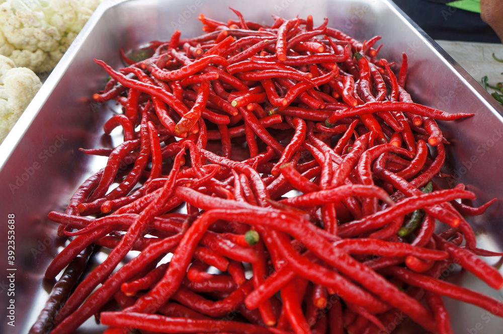 Naklejka premium red hot chili peppers in a pan